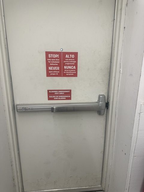Panic bar exit device installed on a commercial door in Broward County